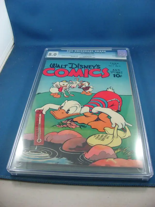 Walt Disney Comics Stories #57 (Dell Comics, 1945), CGC 8.0 graded comic book, Universal Blue label — front cover in its holder
